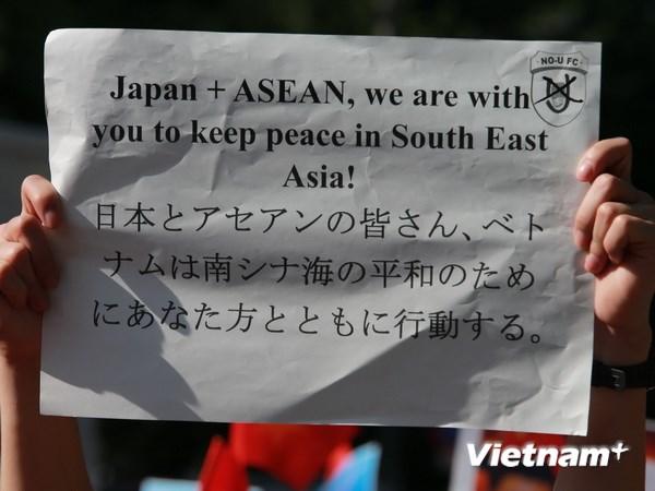 Protest marches against China’s drilling rig through Japanese photographer lens